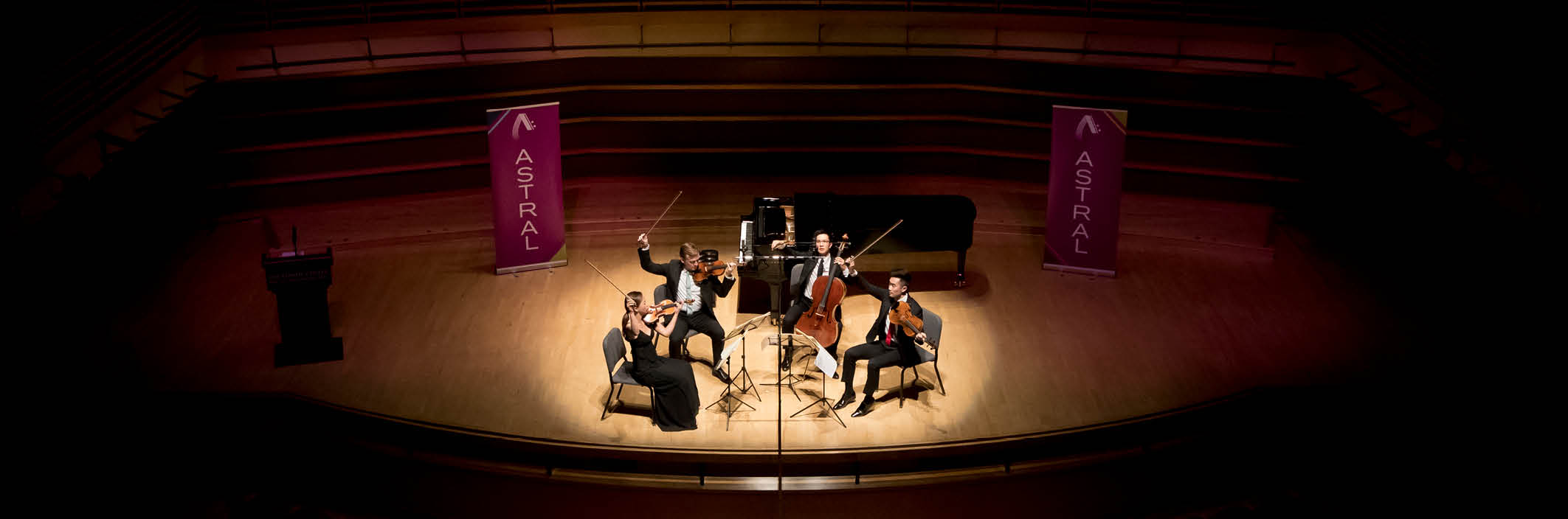 distant view of a string quartet on stage